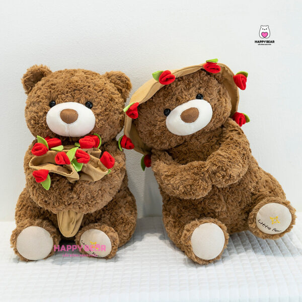 Gấu bông teddy dáng ngồi kèm mũ và ôm hoa hp203