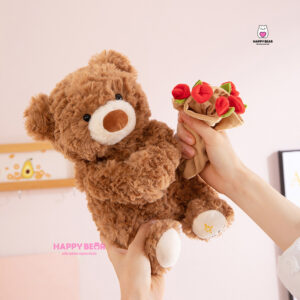 Gấu bông teddy dáng ngồi kèm mũ và ôm hoa hp203