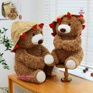 Gấu bông teddy dáng ngồi kèm mũ và ôm hoa hp203